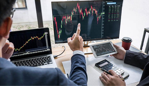 Business team investment working with computer, planning and analyzing graph stock market trading with stock chart data, business financial investment and technology concept 
